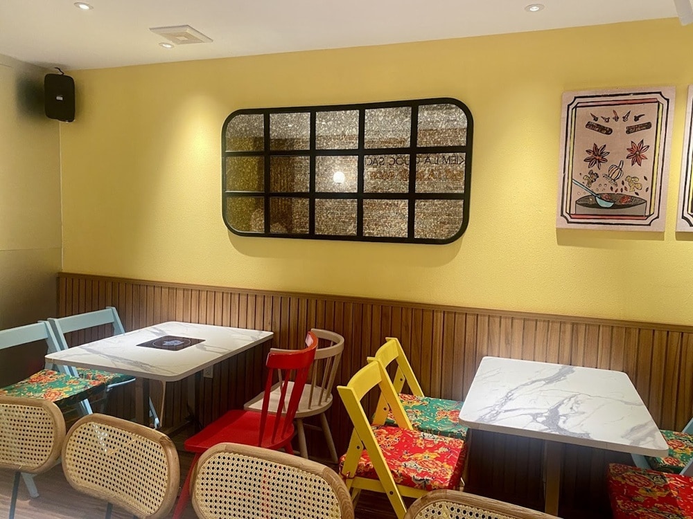 A stylish, modern interior with warm lighting inside pho Sol
